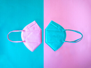 Colored FFP2 mask isolated, pink and green