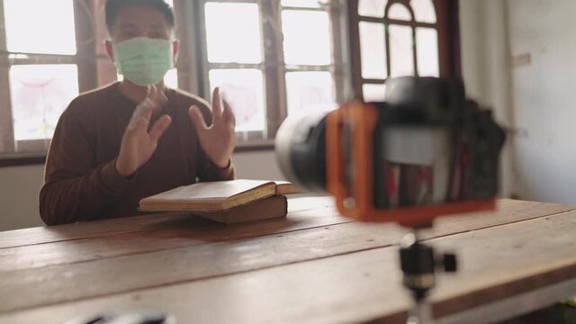 Teachers use dlsr camera equipment to teach students online from home.