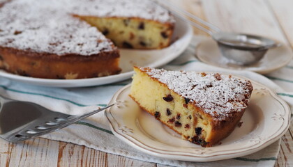 Piece of semolina pie on a wooden background with a napkin.Healthy homemade cakes.