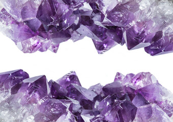 Close up view of large violet amethyst crystal cluster border isolated with white background. Esoteric magical background concept.