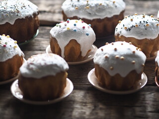 Homemade Easter cakes on a wooden background.