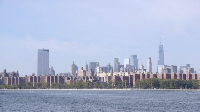 The financial district in Manhattan, New York City from across the east river in Williamsburg, Brooklyn. Focus Pull.