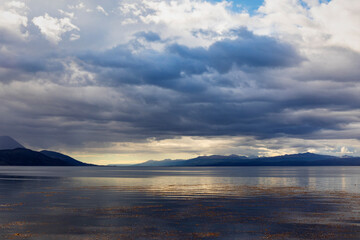 View over the Beagle Channel from Ushuaia towards the Chilean Coast. The sky look menacing and a storm is coming in.