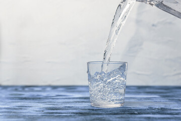 clean drinking water in a glass on white background copy space