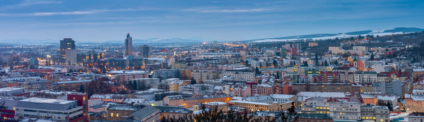 Panoramic view of  Brno in Czech Republic. There is a hospital with heliport in the foreground. Left in the middle there are two towers of Spielberk office centre and AZ tower and M-Palace.  - obrazy, fototapety, plakaty