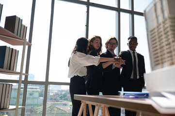 Group of diversity business people hands stack together at the office.