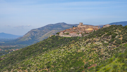 Hill town Sermoneta, famous small village, with medieval Caetani castle on the top, and old stony houses around. Ancient cityscape in Italy, Lazio region, Latina province. Beautiful Italian landscape.