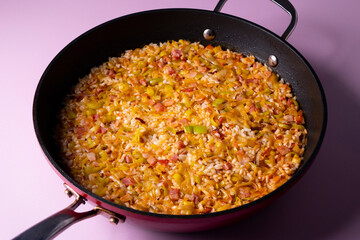 Traditional paella with vegetables and iberico ham