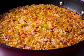 Traditional paella with vegetables and iberico ham