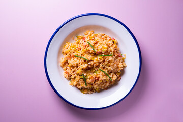 Traditional paella with vegetables and iberico ham