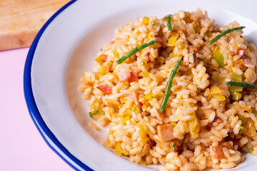 Traditional paella with vegetables and iberico ham