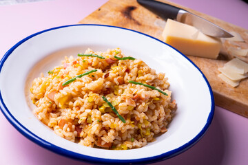 Traditional paella with vegetables and iberico ham