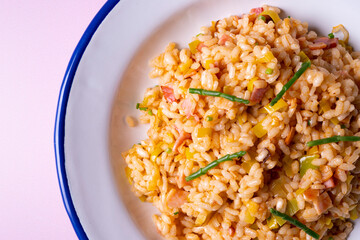 Traditional paella with vegetables and iberico ham