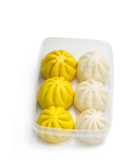 Steamed honey chicken and duck bao buns isolated on white