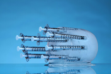 eight syringes in ice
