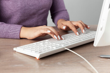 woman working in computer keyboard