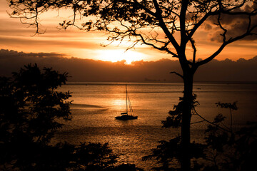 Sail boat and sunset light at lanta beach Thailand