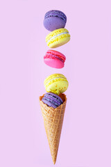 Cake macaroons or macaroons on white background, top view.Different types of macaroons in motion falling on light 
Bright colors, vintage card.Card with sweets.Sweet and colorful french macaroons fall