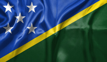 Solomon Islands flag wave close up. Full page Solomon Islands flying flag. Highly detailed realistic 3D rendering