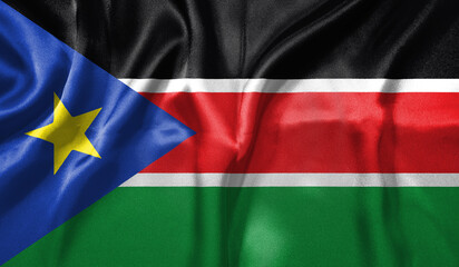 South Sudan flag wave close up. Full page South Sudan flying flag. Highly detailed realistic 3D...