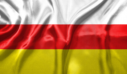 South Ossetia flag wave close up. Full page South Ossetia flying flag. Highly detailed realistic 3D rendering