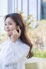 woman talking on cell phone with bluetooth headset