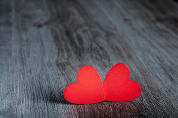 Red hearts on black background
