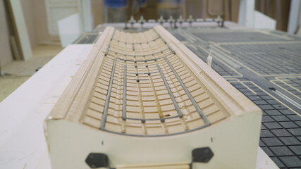 Factory for the production of furniture. Twisted finished wood products in a factory. Furniture...