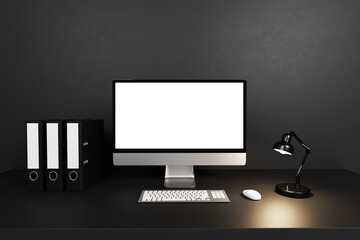 modern clean office workspace with computer; white isolated empty screen in front of dark concrete wall; 3D Illustration