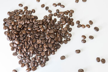 Coffee beans isolated on white background. Close up of a bean of coffee to represent the good smell.	