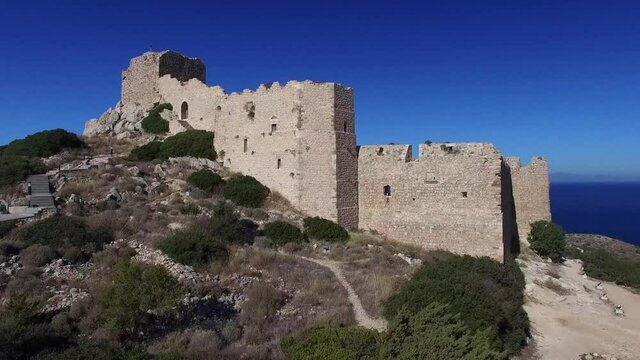 Rhodes Greece : the castle of Kritinia clear blue sky and sea deep on horizon the island of Halki ,winter time