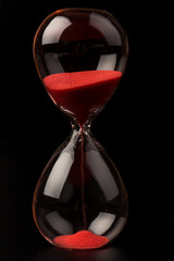 Crystal hourglass on black background as a concept of passing time for business term, urgency and...