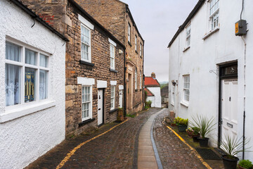 Fototapeta na wymiar Tower Street Castle Wynd, Richmond, North Yorkshire, England, UK: a narrow lane in the centre of this old market town