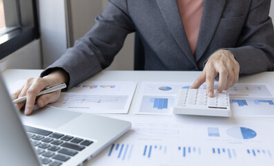 Accounting businesswomen are calculating income-expenditure and analyzing real estate investment...