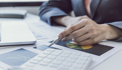 Financial businesswomen analyze the graph of the company's performance to create profits and growth, Market research reports and income statistics, Financial and Accounting concept.