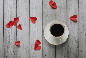 Valentine's day romantic flat lay photography with cup of coffee on a wooden background. 