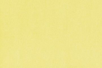 Clean yellow retro paper background. Vintage cardboard texture. Grunge paper for drawing. Simple blank fabric pattern.