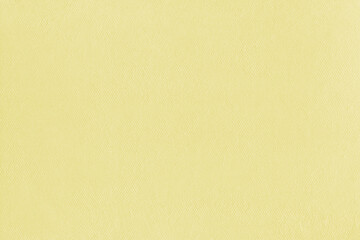 Clean yellow retro paper background. Vintage cardboard texture. Grunge paper for drawing. Simple blank fabric pattern.