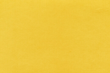 Clean yellow retro paper background. Vintage cardboard texture. Grunge paper for drawing. Simple blank fabric pattern.