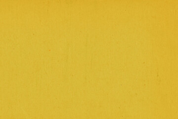 Fototapeta na wymiar Clean yellow retro paper background. Vintage cardboard texture. Grunge paper for drawing. Simple blank fabric pattern.