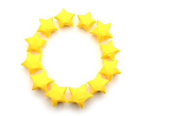 Yellow origami stars in circle sign