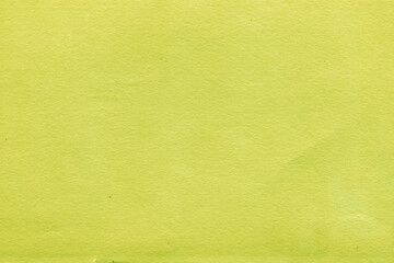 Cardboard green abstract pattern texture close-up. Retro old paper background. Grunge concrete wall. Vintage blank wallpaper.