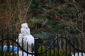 snowman with a white pot on his head