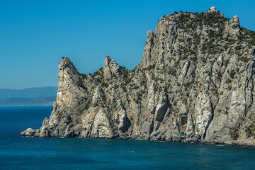 
blue sea and high cliffs