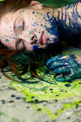 unusual remarkable impressive portrait of a sexy young brunette redhead woman, dots of blue and green color, creative expressive abstract body painting art, make up, copy space.