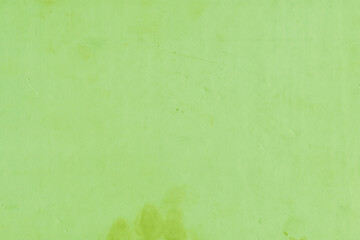 Cardboard green abstract pattern texture close-up. Retro old paper background. Grunge concrete wall. Vintage blank wallpaper.