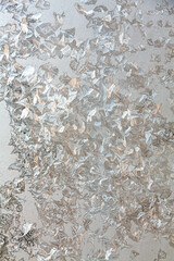 a winter window covered by frost