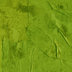 Cardboard green abstract pattern texture close-up. Retro old paper background. Grunge concrete wall. Vintage blank wallpaper.