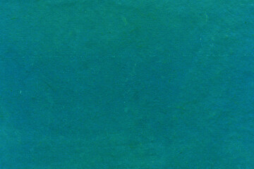 Cardboard green abstract pattern texture close-up. Retro old paper background. Grunge concrete...