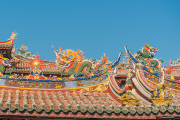 Fototapeta premium Sunset view of a wind turbine farm on top of mountain.